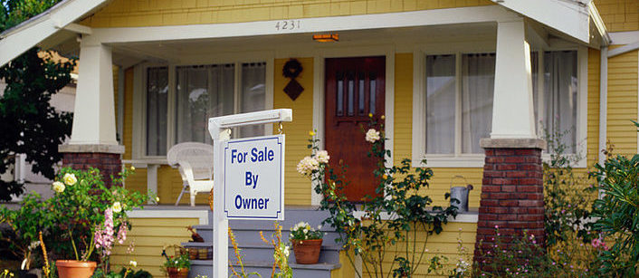 House With a For Sale By Owner Sign